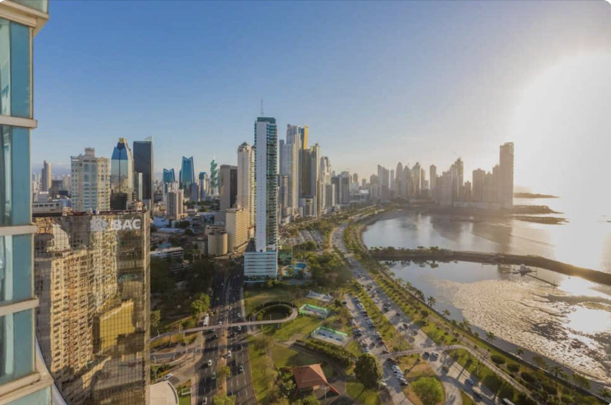 Aerial view contrasting Grand Cayman and Panama City.