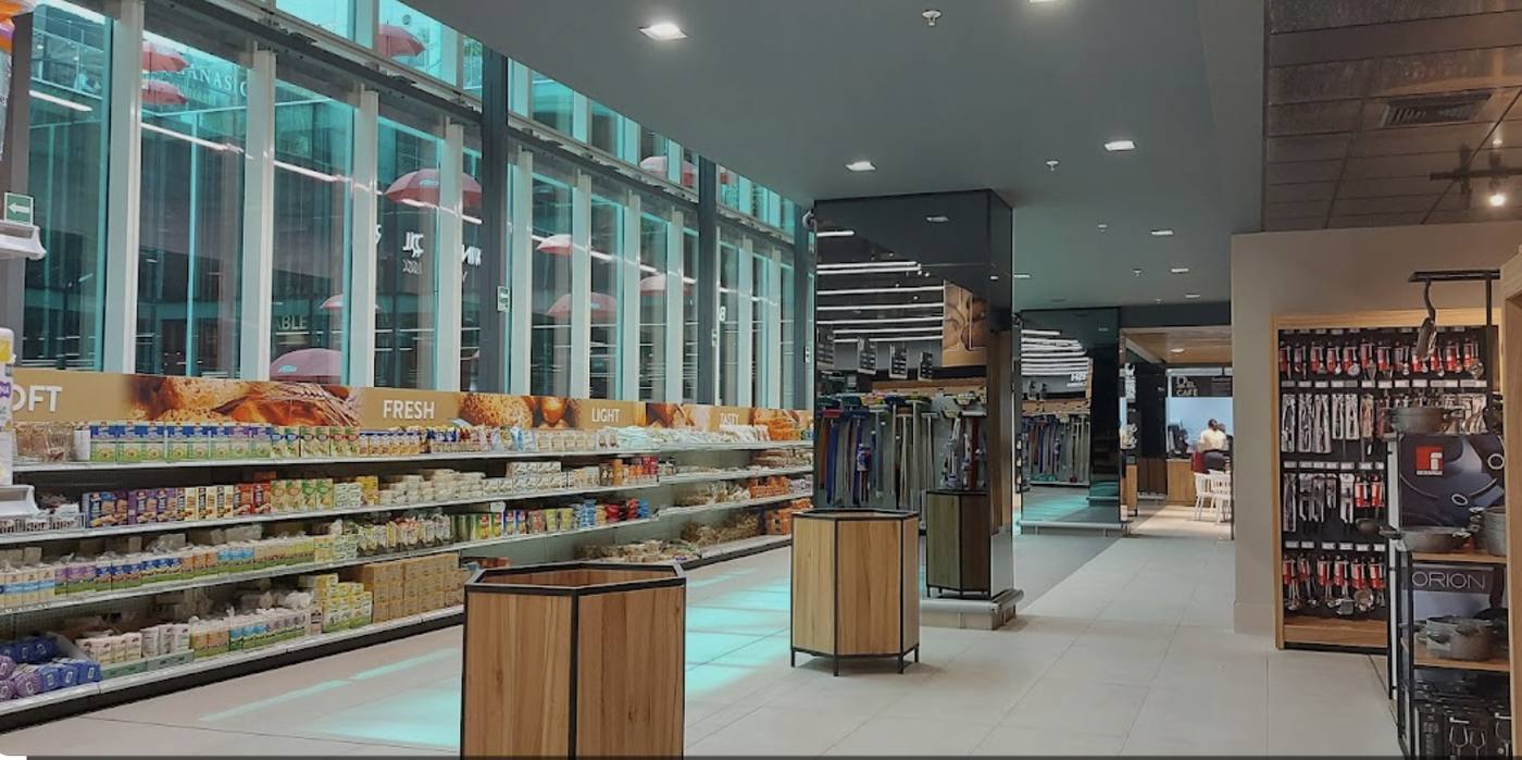 Interior of a modern Panama City supermarket aisle — indicative of daily retail pricing.